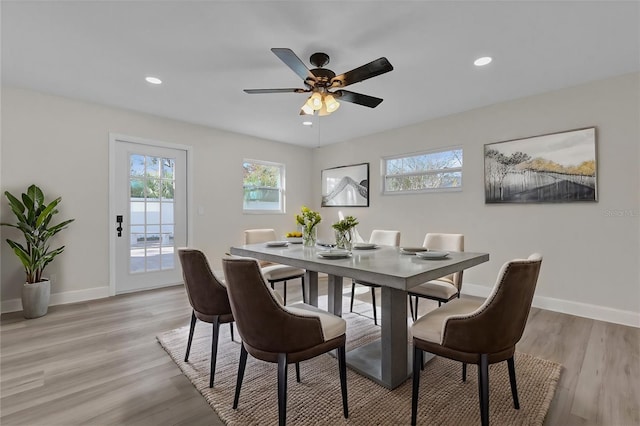 dining space featuring ceiling fan and light hardwood / wood-style flooring