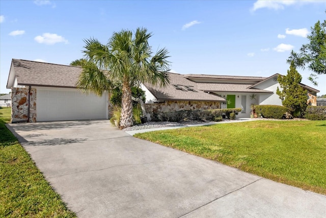 9 Crow Ct, Palm Coast, FL 32137 - view of front facade with concrete driveway, a front yard, an attached garage, stone siding, and stucco siding