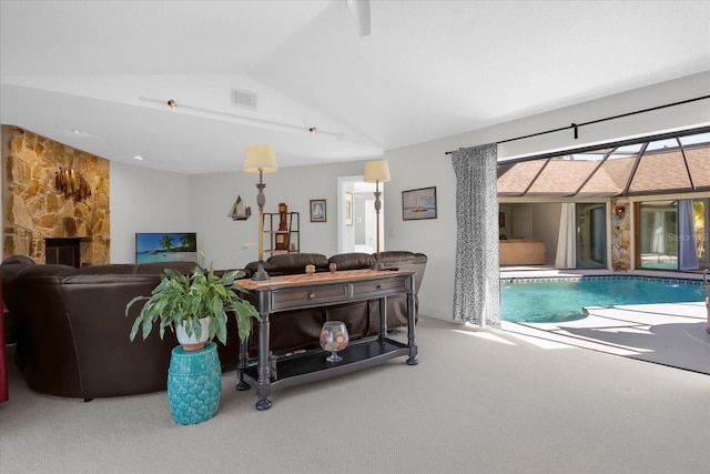 9 Crow Ct, Palm Coast, FL 32137 - living area featuring carpet flooring and vaulted ceiling