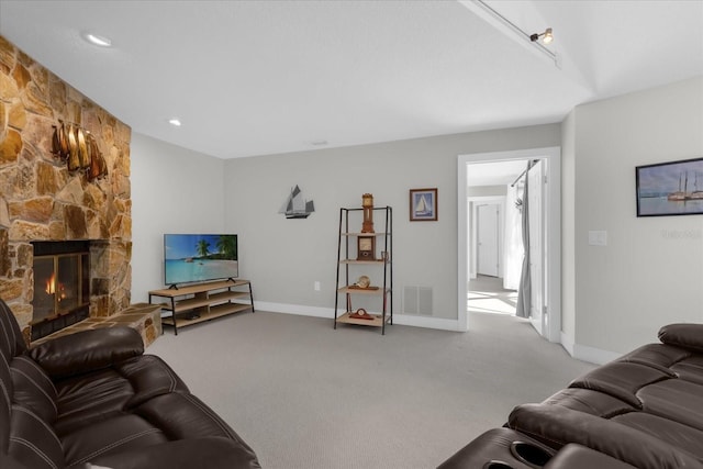 9 Crow Ct, Palm Coast, FL 32137 - carpeted living area with a stone fireplace and baseboards