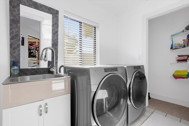 9 Crow Ct, Palm Coast, FL 32137 - laundry room with cabinet space, separate washer and dryer, and light tile patterned floors