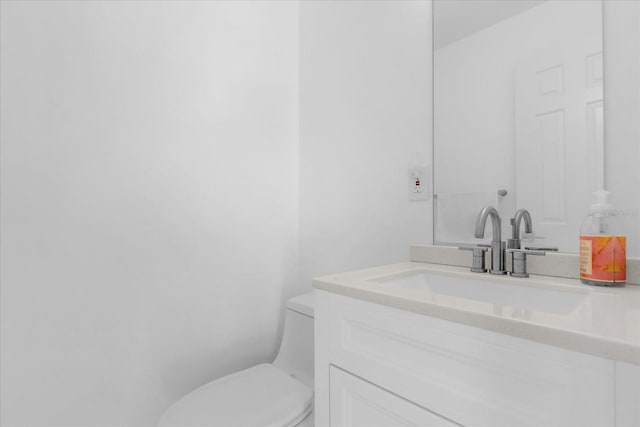 9 Crow Ct, Palm Coast, FL 32137 - bathroom featuring vanity and toilet