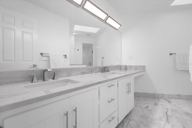 9 Crow Ct, Palm Coast, FL 32137 - full bathroom featuring a skylight, marble finish flooring, and double vanity