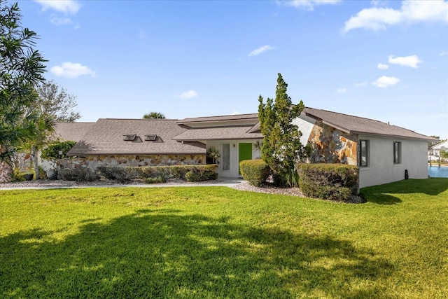 9 Crow Ct, Palm Coast, FL 32137 - view of front of property with a front lawn and stucco siding