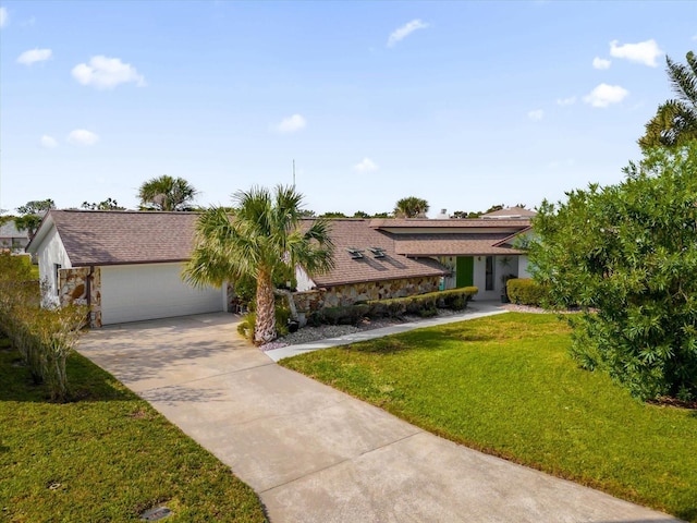 9 Crow Ct, Palm Coast, FL 32137 - view of front of property with driveway, an attached garage, a front yard, and stone siding