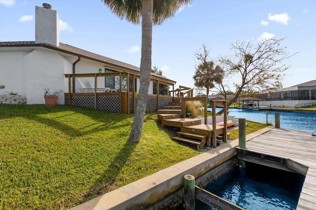 9 Crow Ct, Palm Coast, FL 32137 - dock area featuring a yard, a deck with water view, and stairs