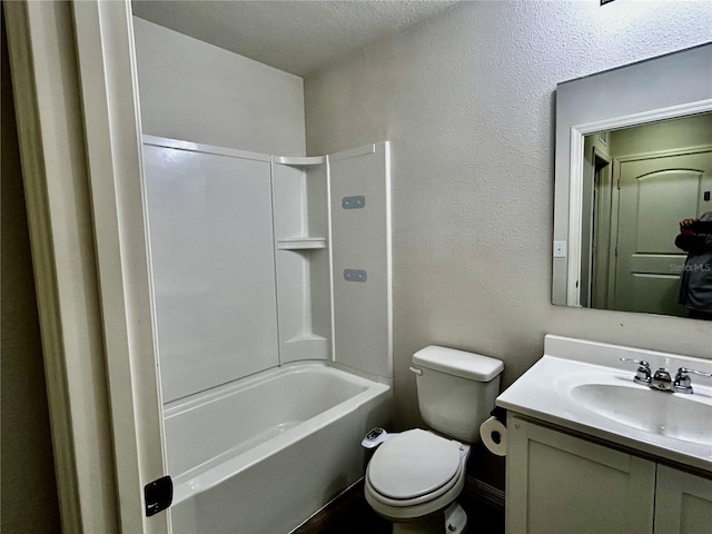 full bathroom with washtub / shower combination, vanity, a textured ceiling, and toilet