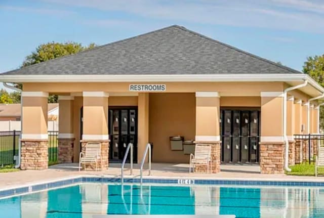 exterior space featuring a community pool and a patio area