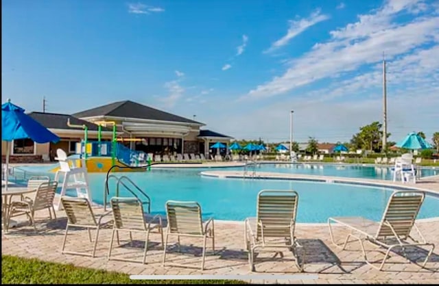 view of pool featuring a patio