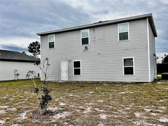 back of house with a yard