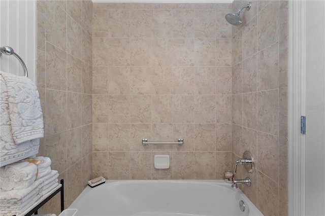 bathroom featuring tiled shower / bath combo