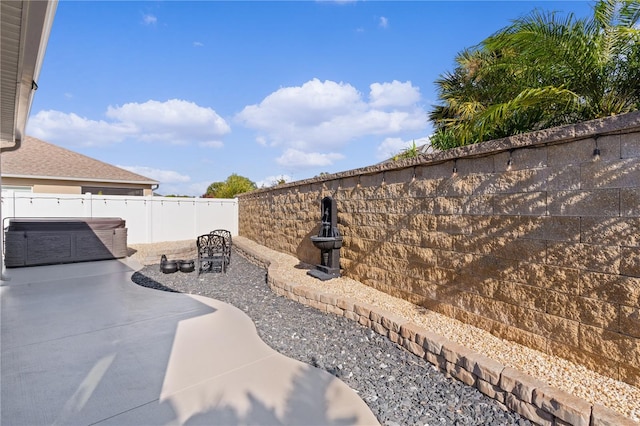 exterior space featuring a jacuzzi