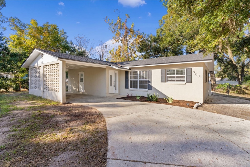 ranch-style house with a carport