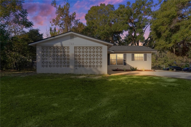 view of front of house with a lawn