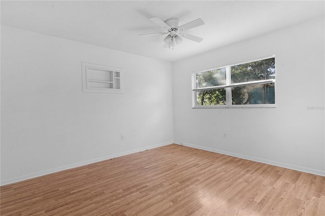 unfurnished room featuring ceiling fan and light hardwood / wood-style flooring