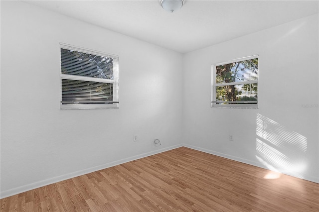 spare room featuring hardwood / wood-style flooring