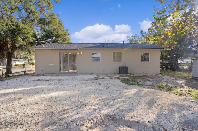 back of property with central AC unit