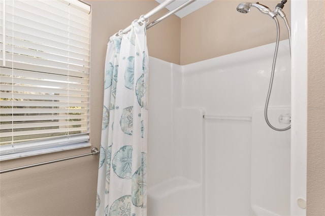 bathroom featuring walk in shower