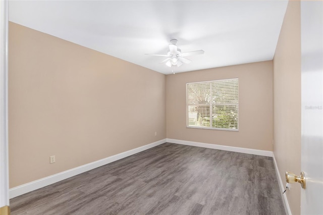 spare room with hardwood / wood-style flooring and ceiling fan