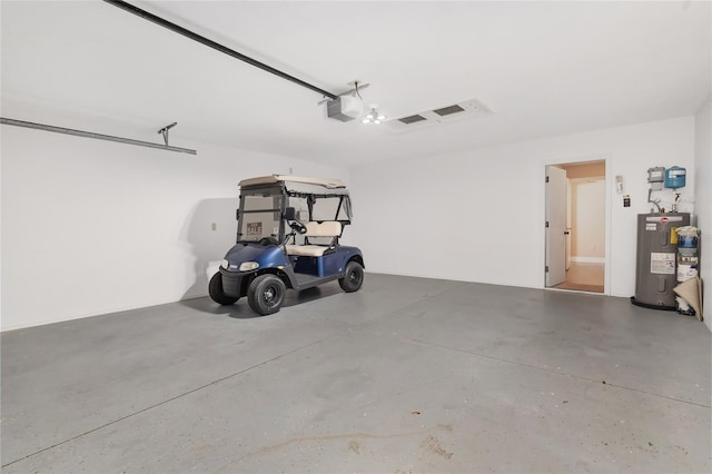 garage featuring a garage door opener and water heater