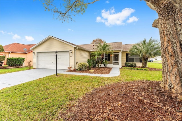 ranch-style home featuring an attached garage, driveway, and a front yard