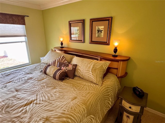 carpeted bedroom featuring ornamental molding