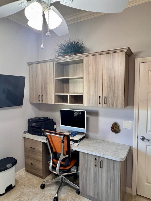 office space with ceiling fan, light tile patterned flooring, built in desk, and crown molding