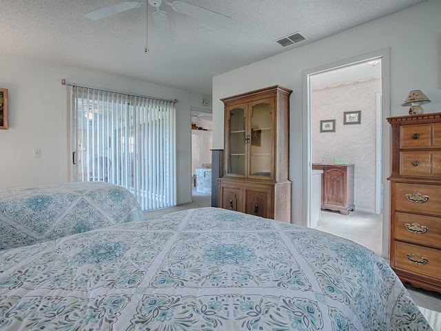 bedroom with light carpet, access to exterior, a textured ceiling, and ceiling fan