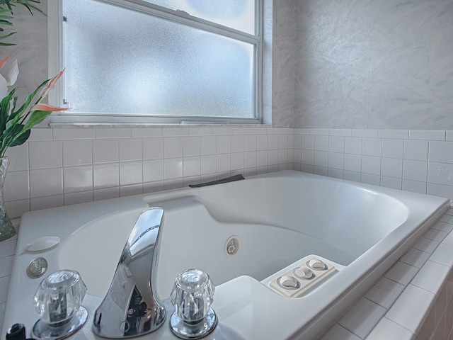 bathroom with tiled bath