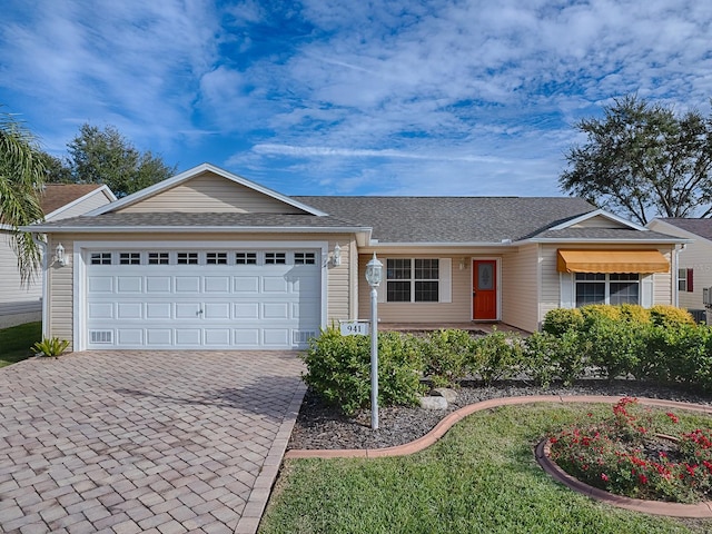 single story home featuring a garage