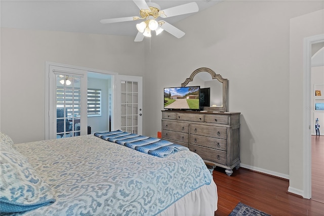 bedroom with dark hardwood / wood-style flooring, vaulted ceiling, and ceiling fan