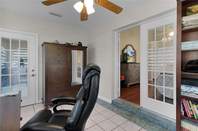 tiled home office with ceiling fan