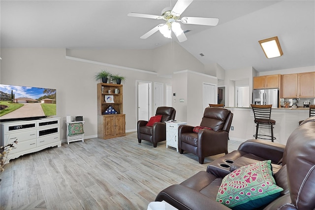 living room with ceiling fan, high vaulted ceiling, and light wood-type flooring