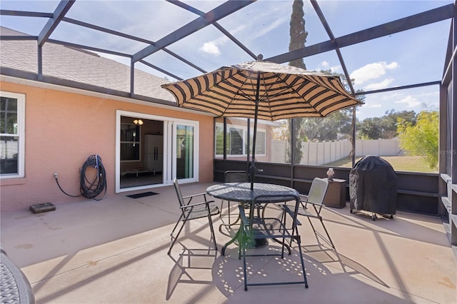 view of patio / terrace with a grill and a lanai