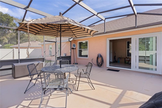 view of patio featuring a lanai