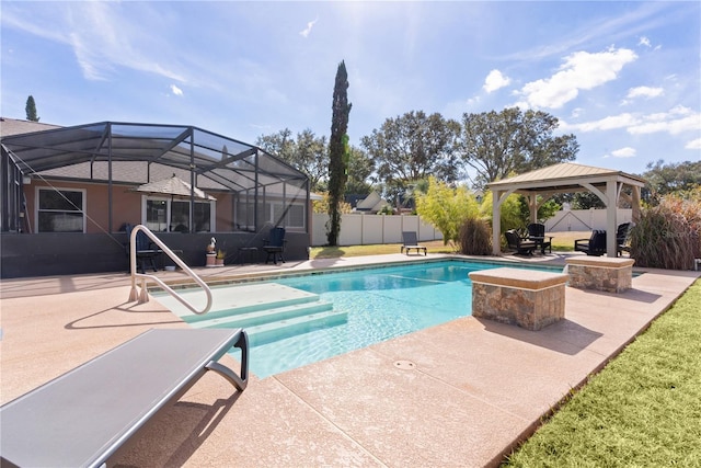 view of swimming pool with a gazebo, a patio, and glass enclosure