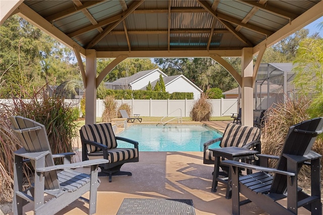 view of swimming pool featuring a gazebo, a lanai, and a patio area