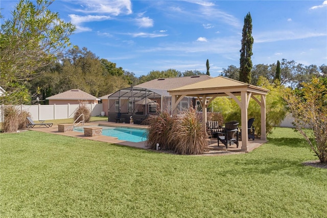 view of pool featuring a gazebo, glass enclosure, a patio area, and a lawn