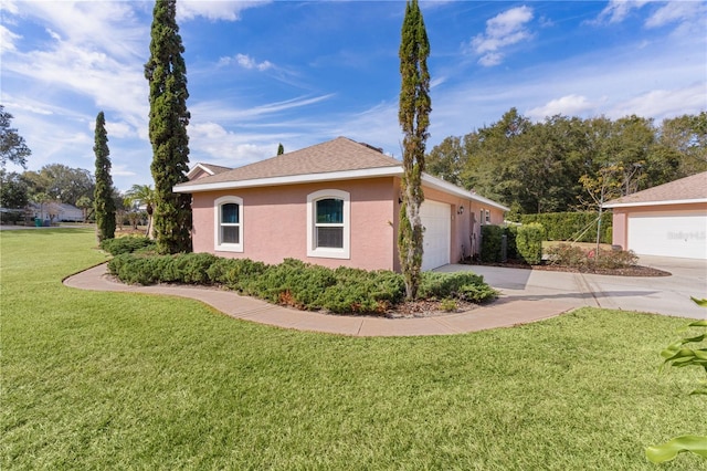 view of side of home featuring a yard and a garage