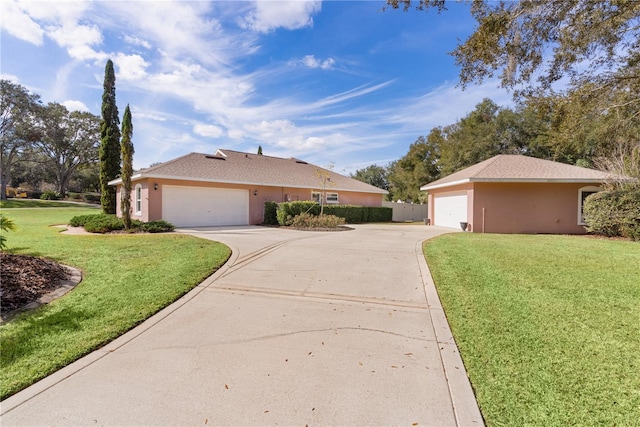 ranch-style home featuring a garage and a front yard