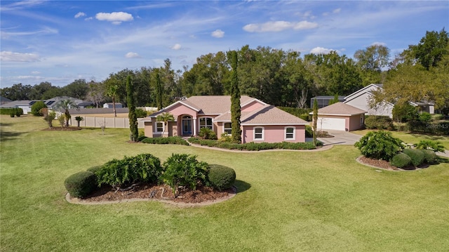 ranch-style home with a garage and a front yard