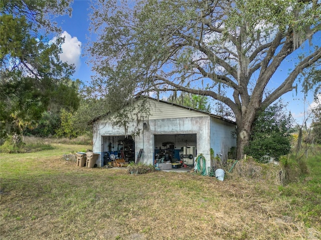 view of outbuilding with a yard