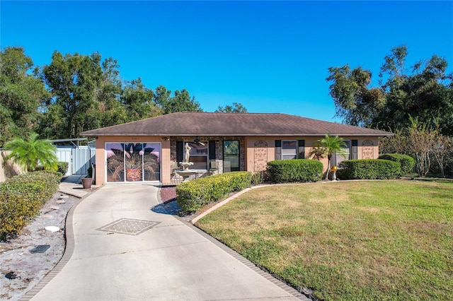 ranch-style home featuring a front yard