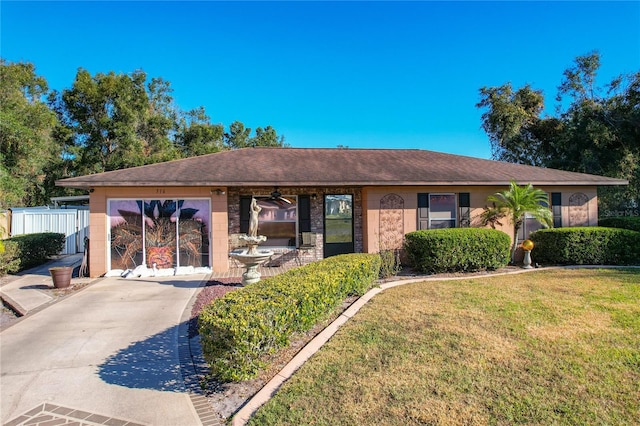 single story home featuring a front yard