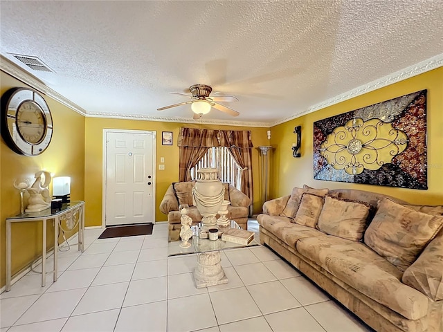 tiled living room with a textured ceiling, ceiling fan, and crown molding