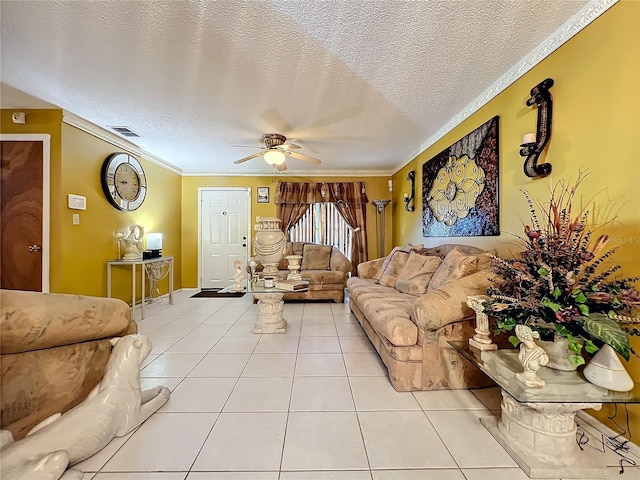 living room featuring ceiling fan, crown molding, light tile patterned flooring, and a textured ceiling