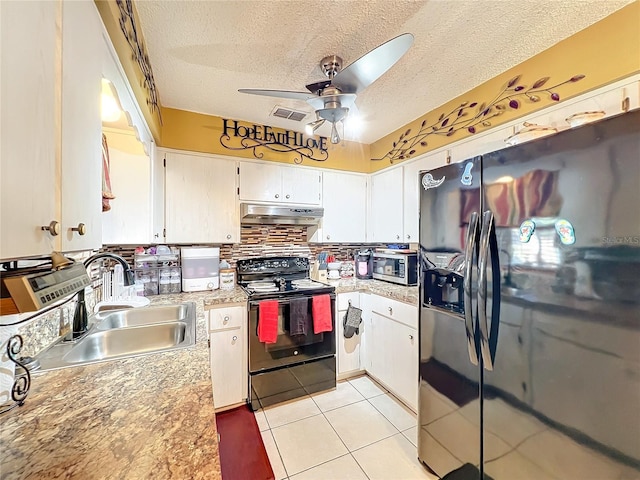 kitchen with appliances with stainless steel finishes, a textured ceiling, ceiling fan, sink, and white cabinets