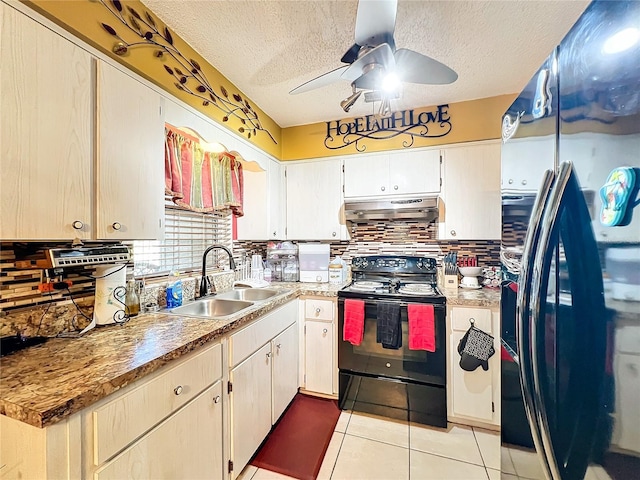 kitchen featuring a textured ceiling, ventilation hood, ceiling fan, sink, and black appliances