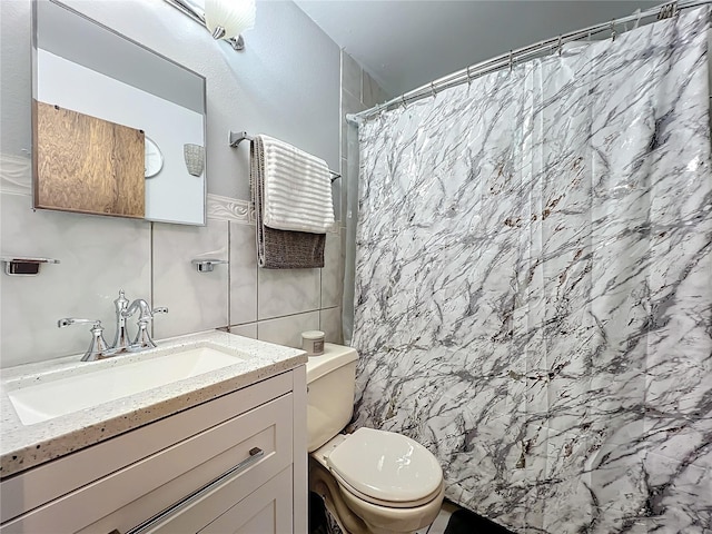 bathroom featuring walk in shower, vanity, tile walls, and toilet