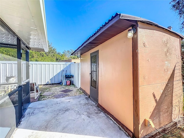 view of side of home featuring a patio area